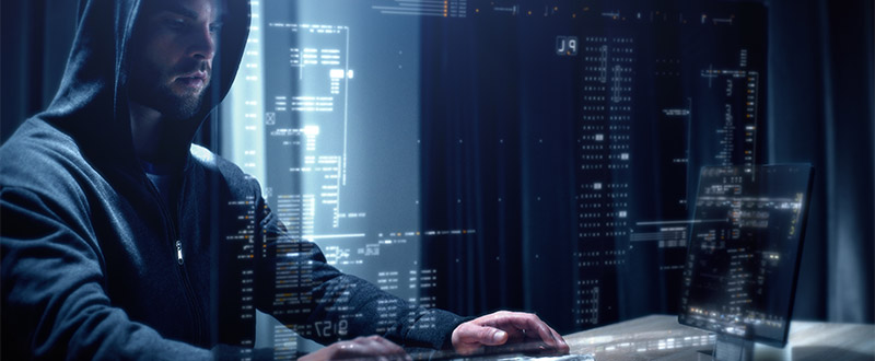 Hacker at a computer keyboard