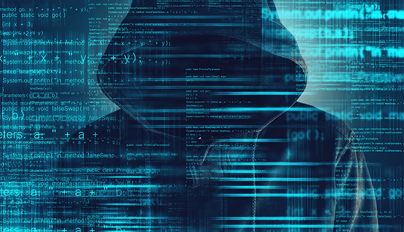 hacker wearing a hoodie