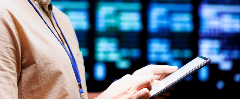 closeup of hands holding a tablet device